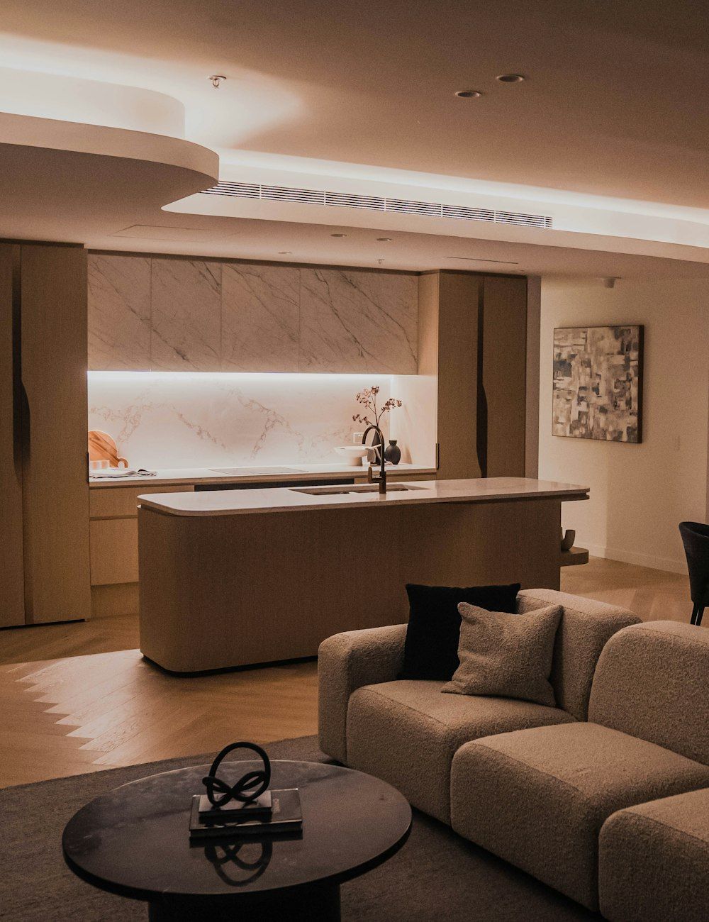 An open-plan kitchen and sitting room in a serviced apartment