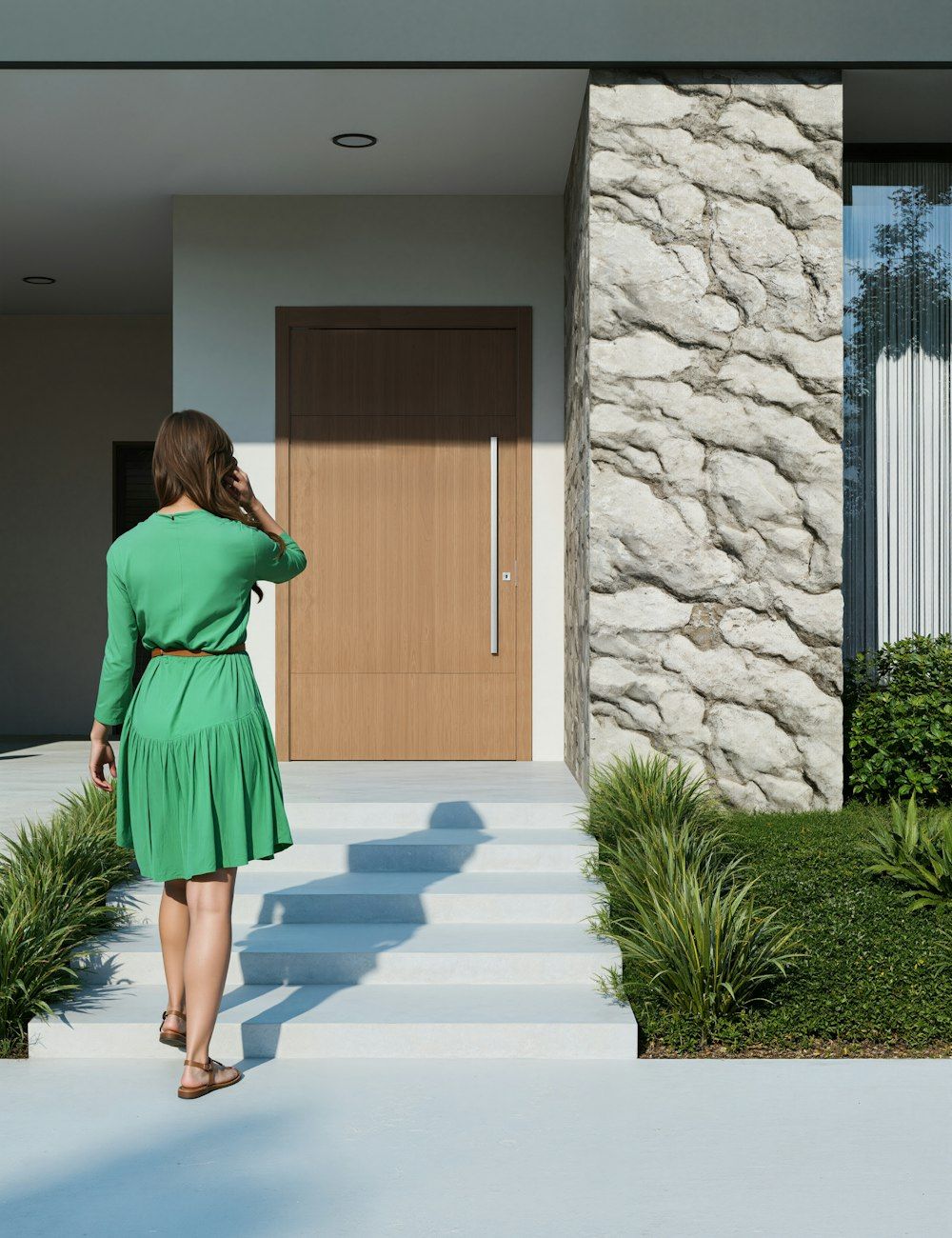A woman walking up the steps to her house